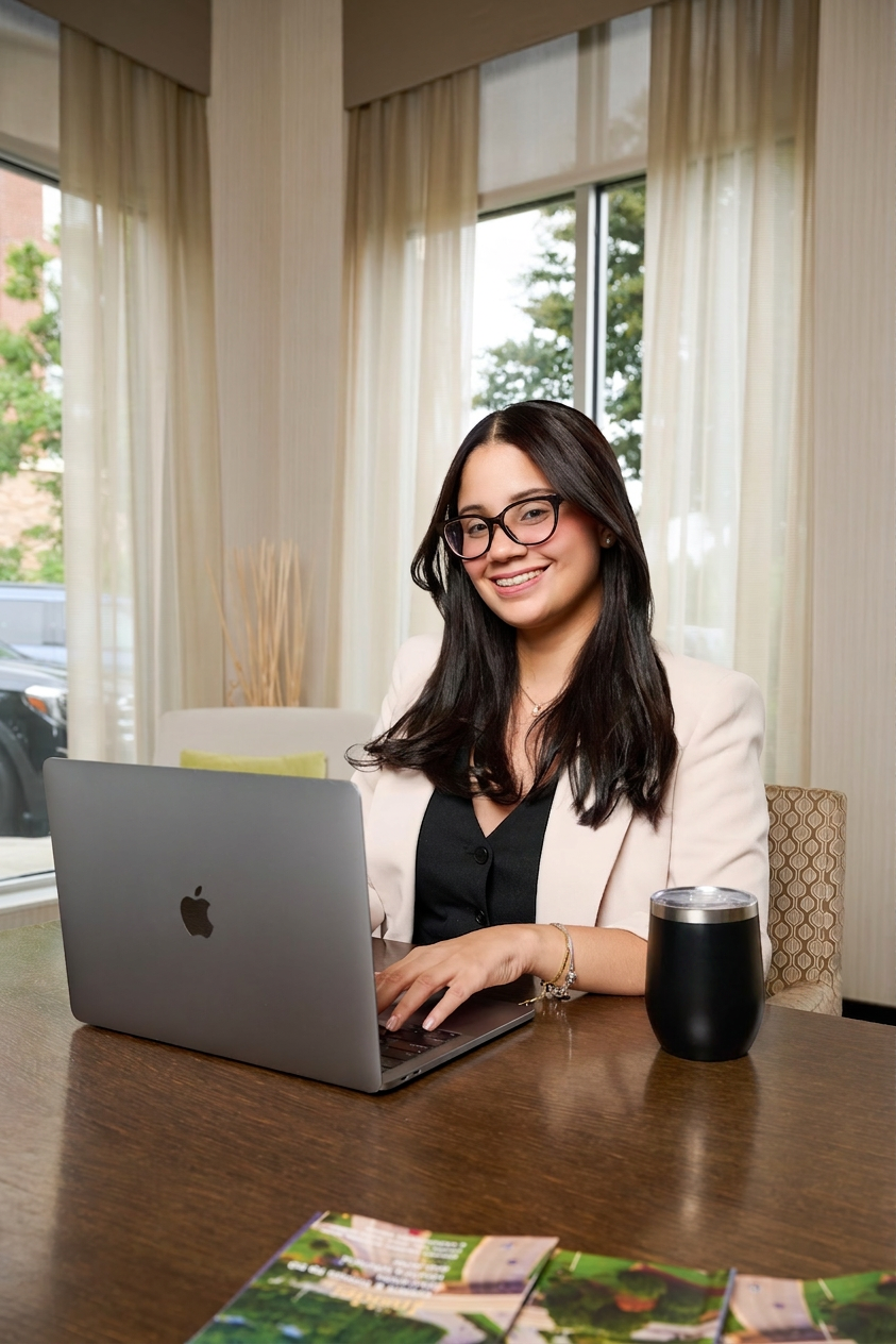 Raymarie Guillen working at her laptop